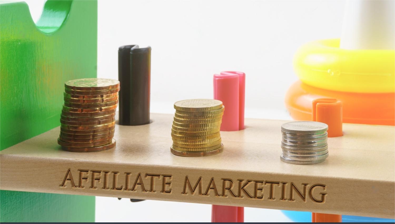 stock-photo-affiliate-marketing-written-on-wood-with-golden-and-silver-coins-stacked-with-plastic-toy-bar-on-589414532-transformed.jpeg